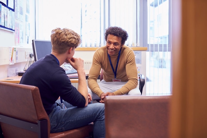Male counselor and student iStock